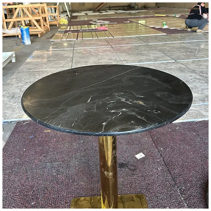 Nero Picaso black marble round coffee table with brass base for hotels mansions and luxury residences