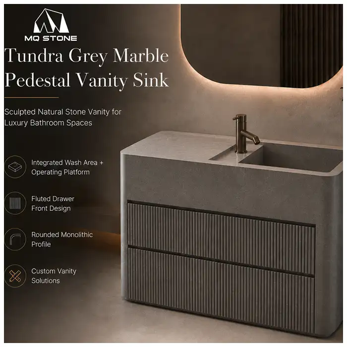 Savana Gray Marble pedestal sink in luxury bathroom project with grey marble vanity and fluted drawers