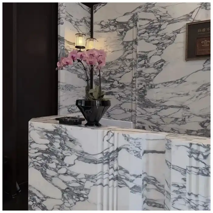 Arabescato-Corchia-reception-desk-with-bookmatched-front-panels-and-marble-countertop-edge Arabescato-Corchia-reception-desk-with-bookmatched-front-panels-and-marble-countertop-edge