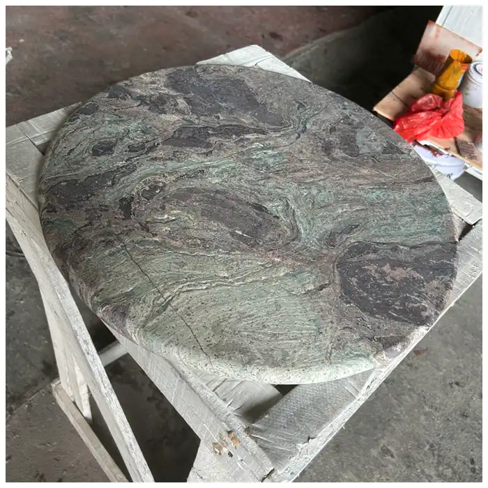 Round Nebula Breccia natural marble cuttings showing different green and charcoal patterns