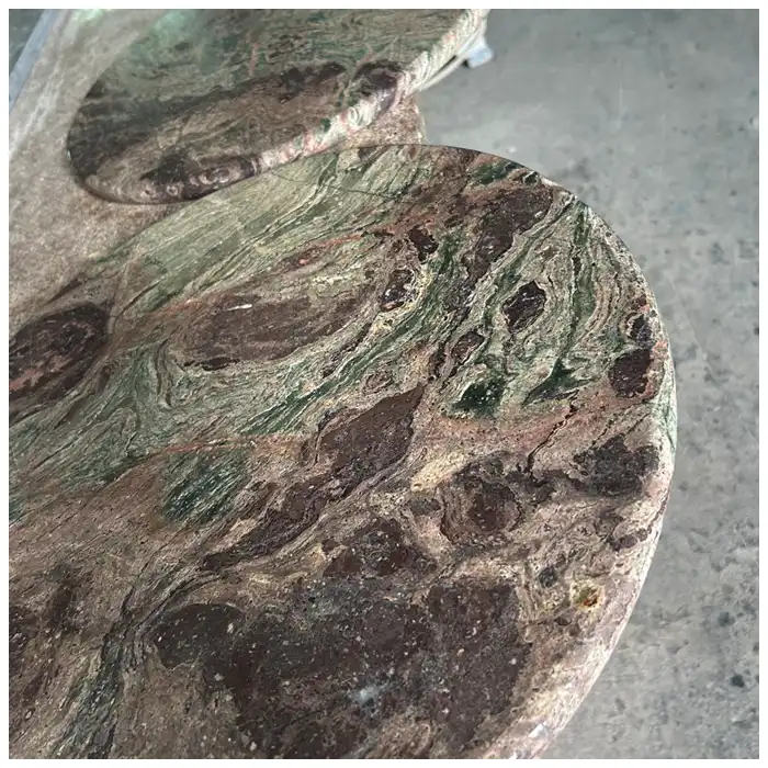 Nebula Breccia round marble top for edge shaping and base support coordination